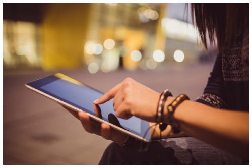 Stylish Woman Searching On Tablet for Online Jewelry Store