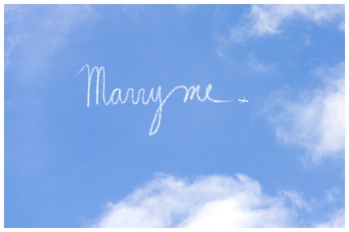 Skywriter Writing Marry Me in the Blue Sky