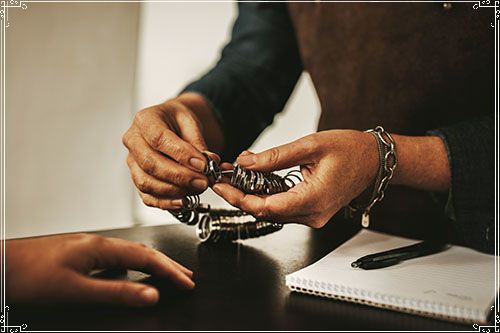 Jeweler Checking Someone's Ring Size