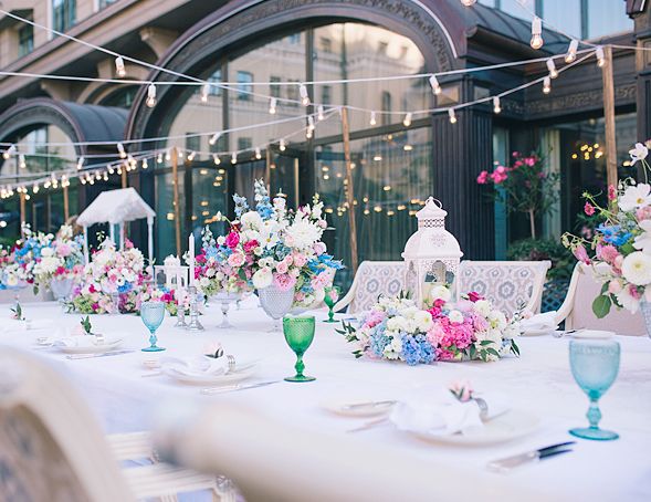 Emerald green, white, fuchsia, and dusty blue spring wedding outdoor reception table