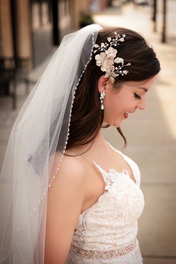 bride wearing wedding veil with embellished details