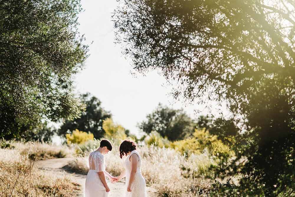 bride and bride eloping outside on their wedding day