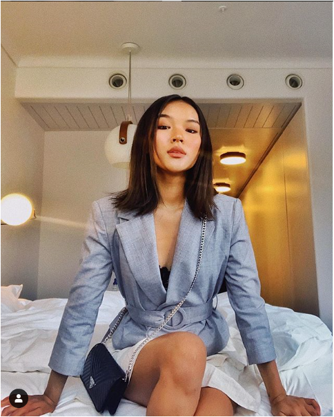 Wearing the white tweed Isla Blazer for women by J.ING