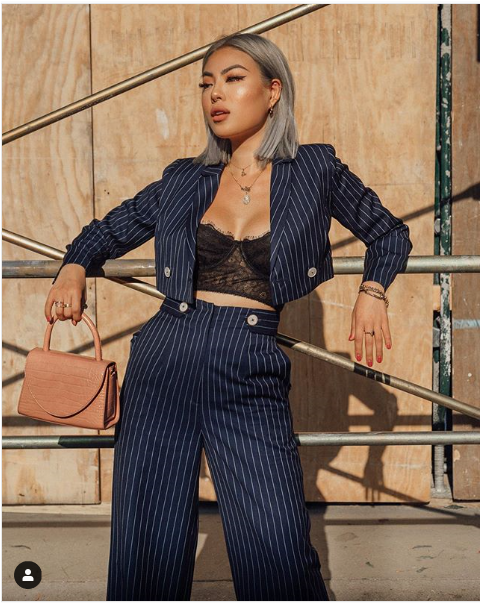 Wearing the white tweed Isla Blazer for women by J.ING
