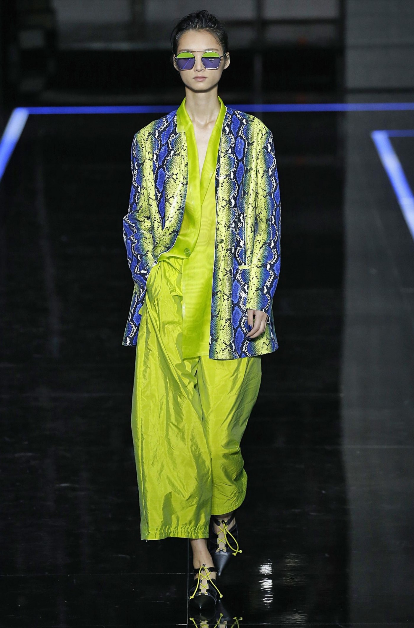 Neon green snakeskin blazer on model for