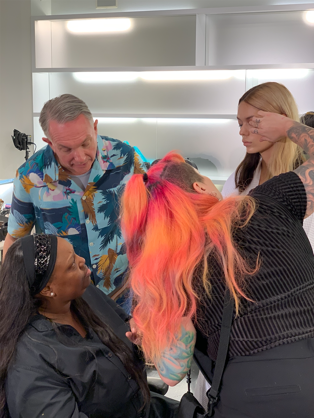 A group of women are getting their hair done in a salon - Josh Wood Hair Colour Expert