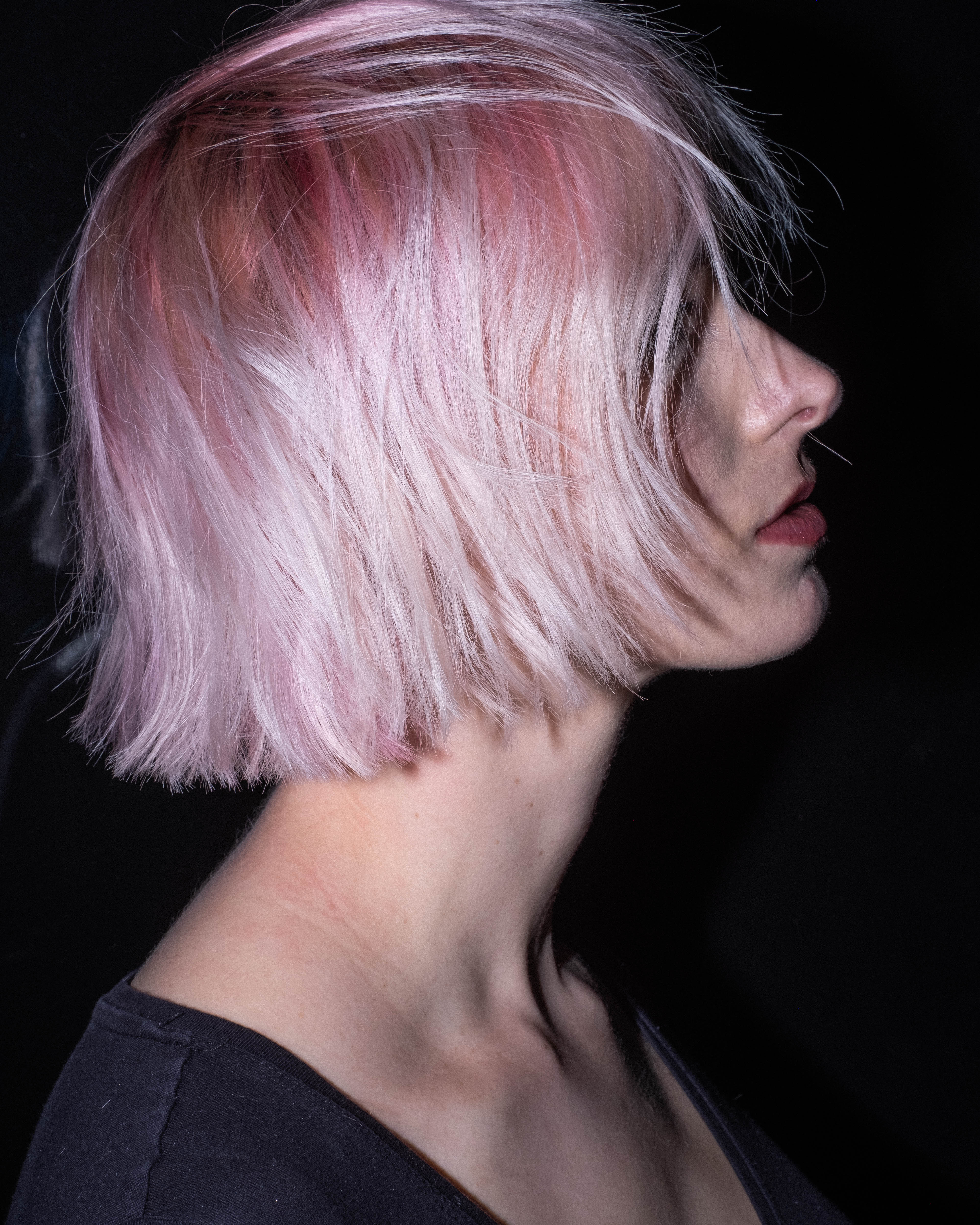 A woman with a pink bob hairstyle - Josh Wood Hair Colour Expert