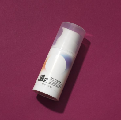 A tube of hair mask on a pink background - Josh Wood Hair Colour Expert