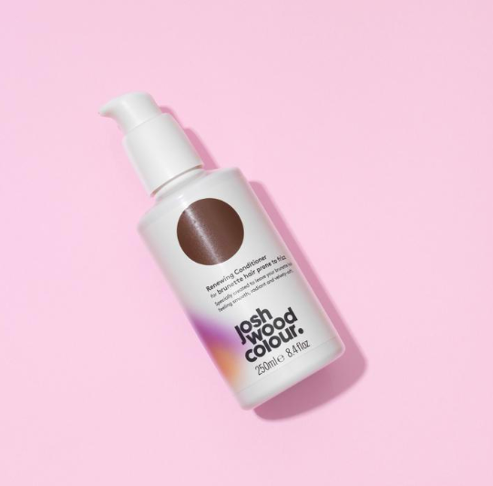 A bottle of dark brown hair colour on a pink background - Josh Wood Hair Colour Expert