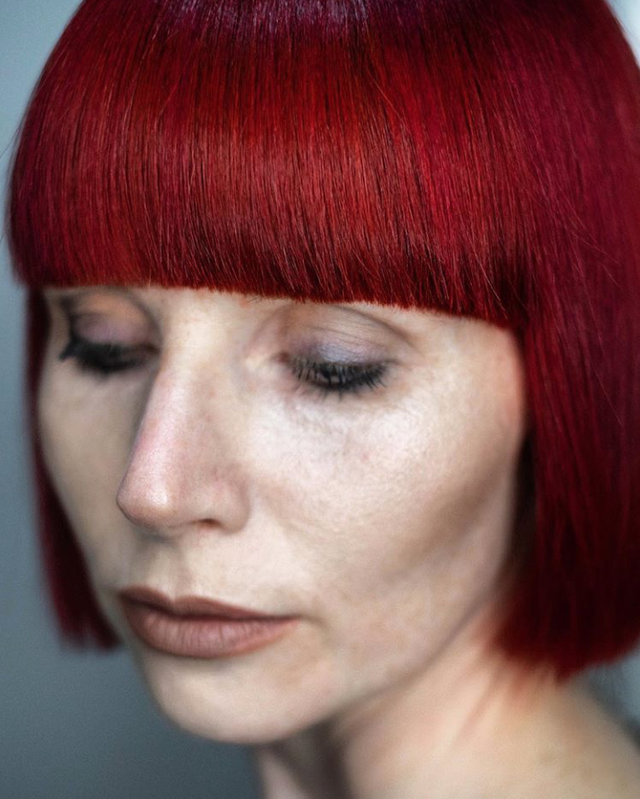 A woman with a red bob with bangs - Josh Wood Hair Colour Expert