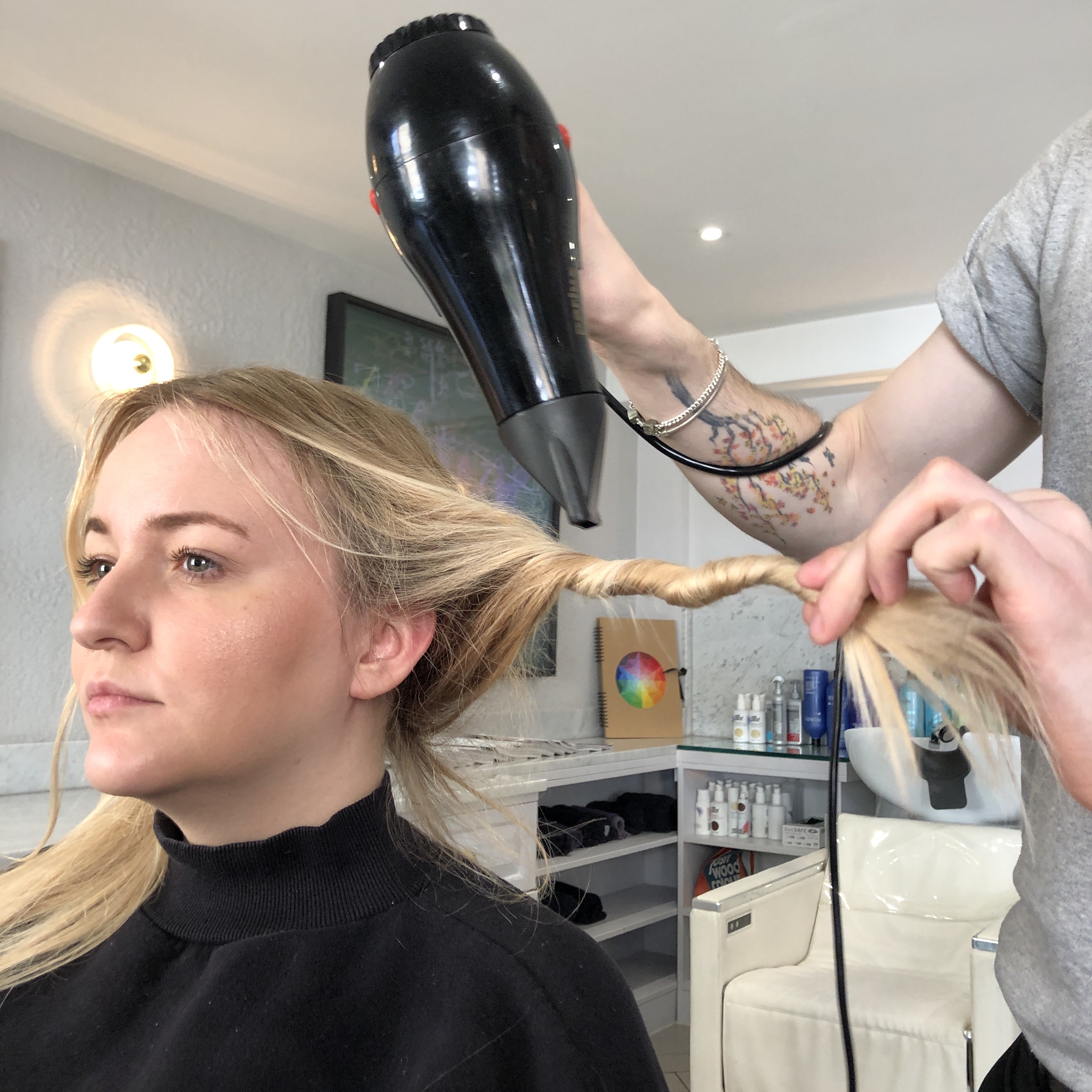 A woman with her hair pulled back - Josh Wood Hair Colour Expert