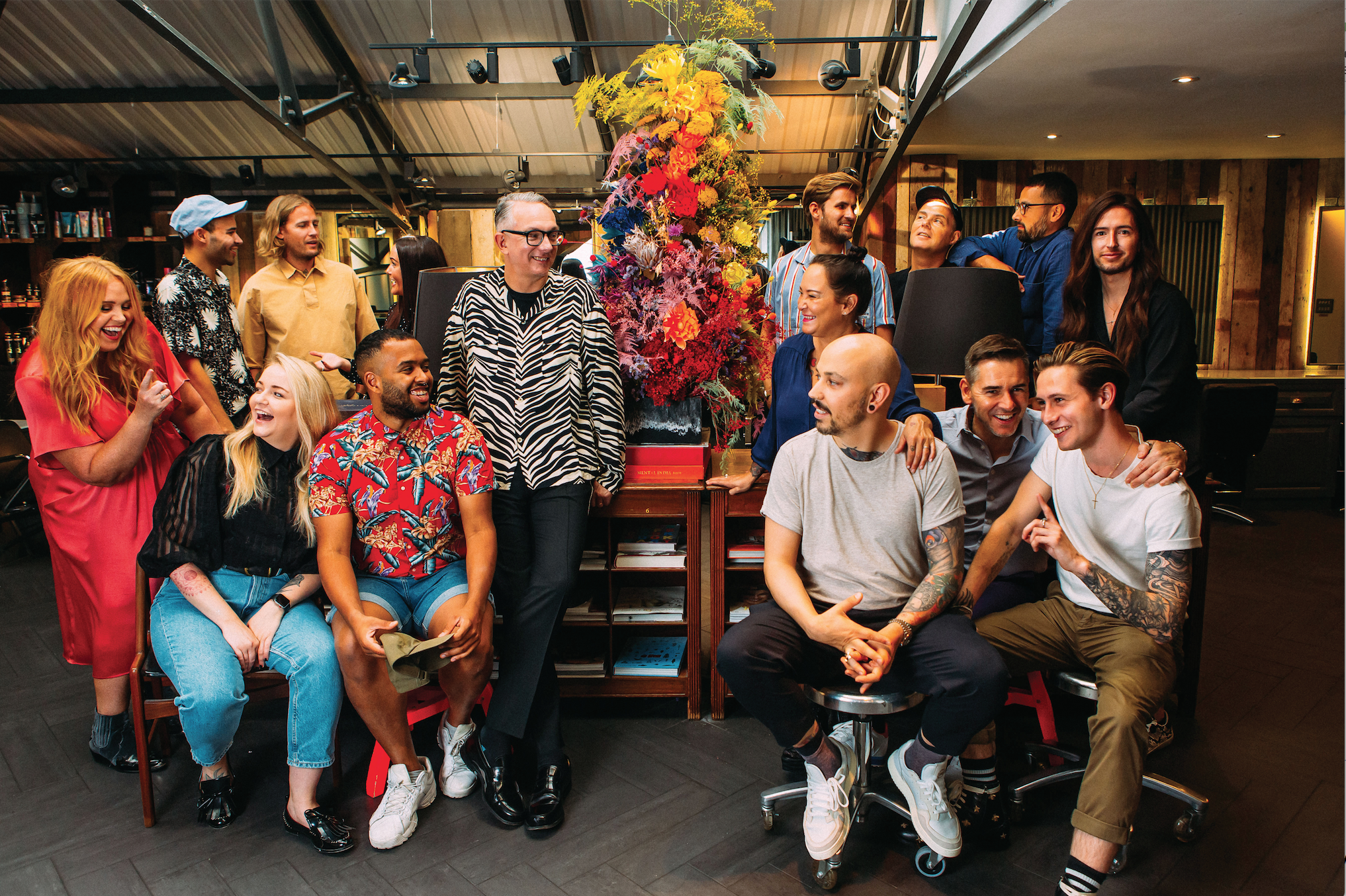 A group of people posing for a photo in a room - Josh Wood Hair Colour Expert