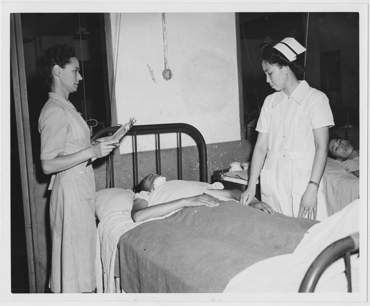 From the United Nations archive: a 1948 photo titled "Miss Ray and Chinese nurse colleague are seen at the bedside of a sick man."⁠