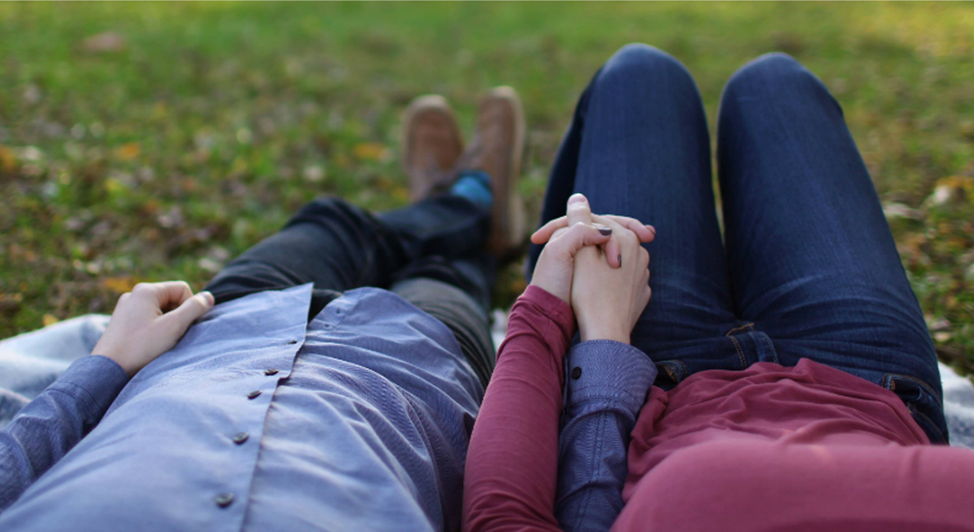 Couple holding hands in park