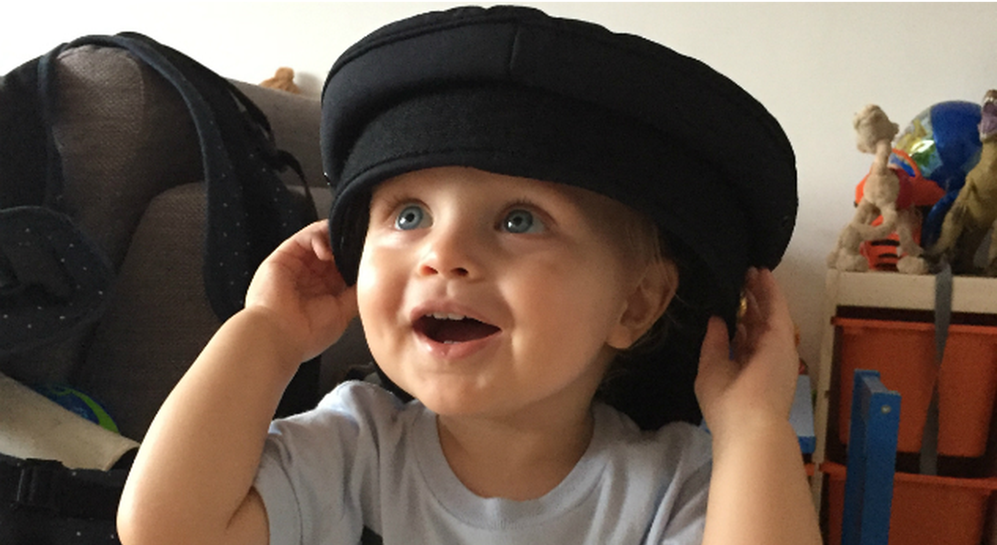 Toddler wears pilot's hat