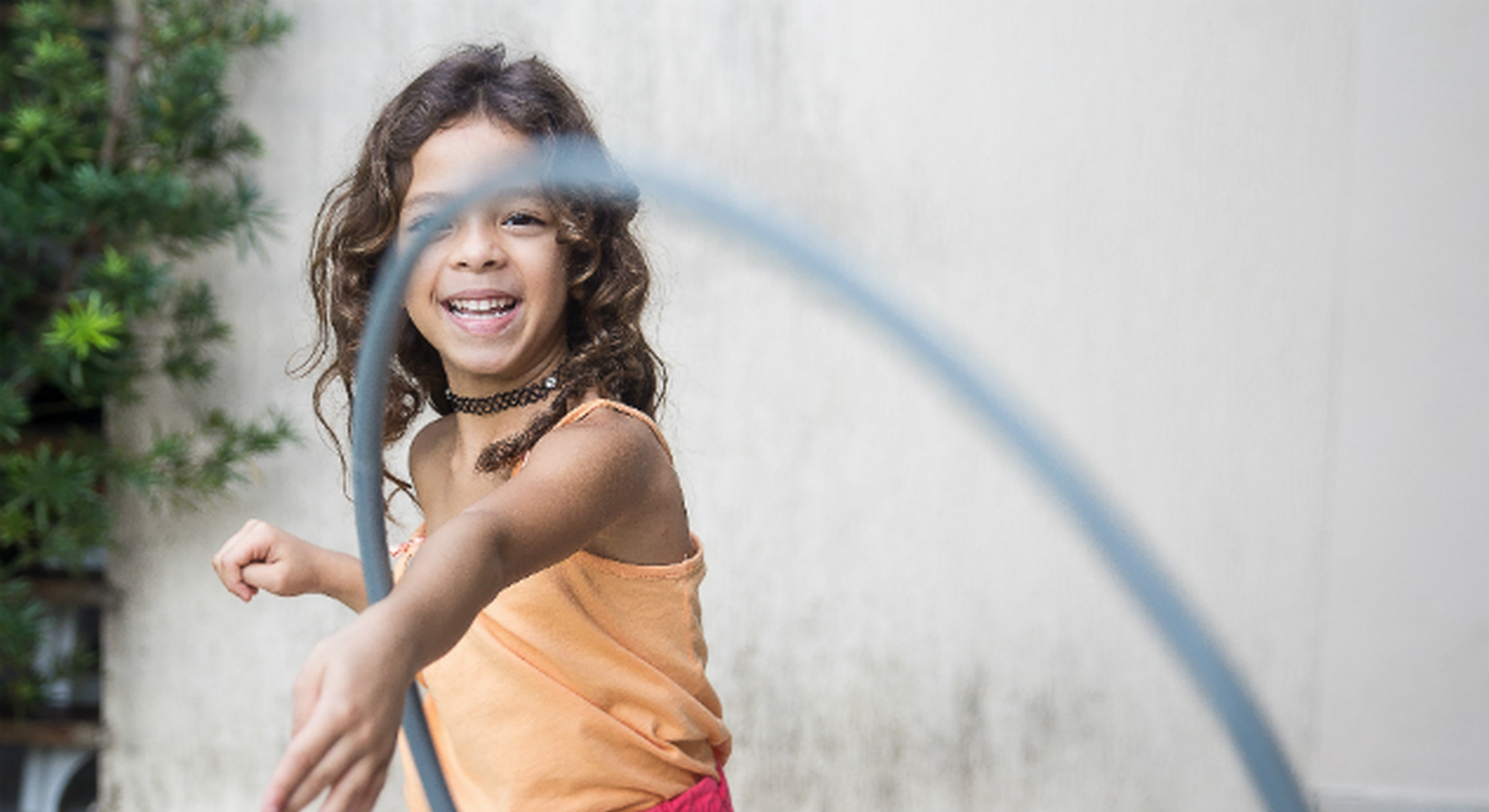 Girl playing with a hula hoop