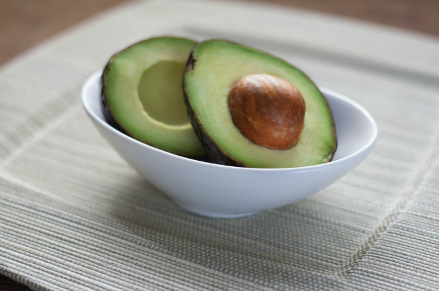 Sliced avocado sitting in a bowl