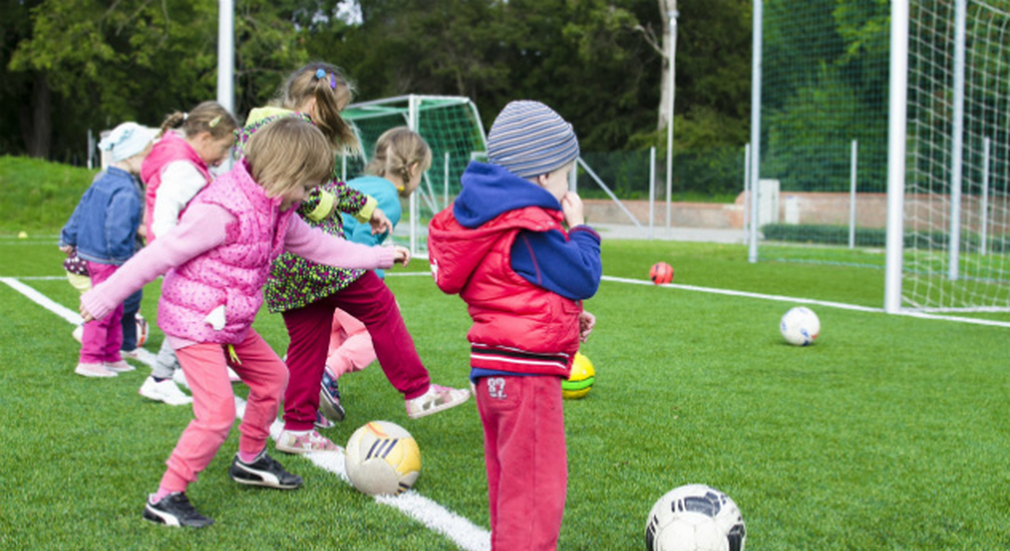 Young kids playing football