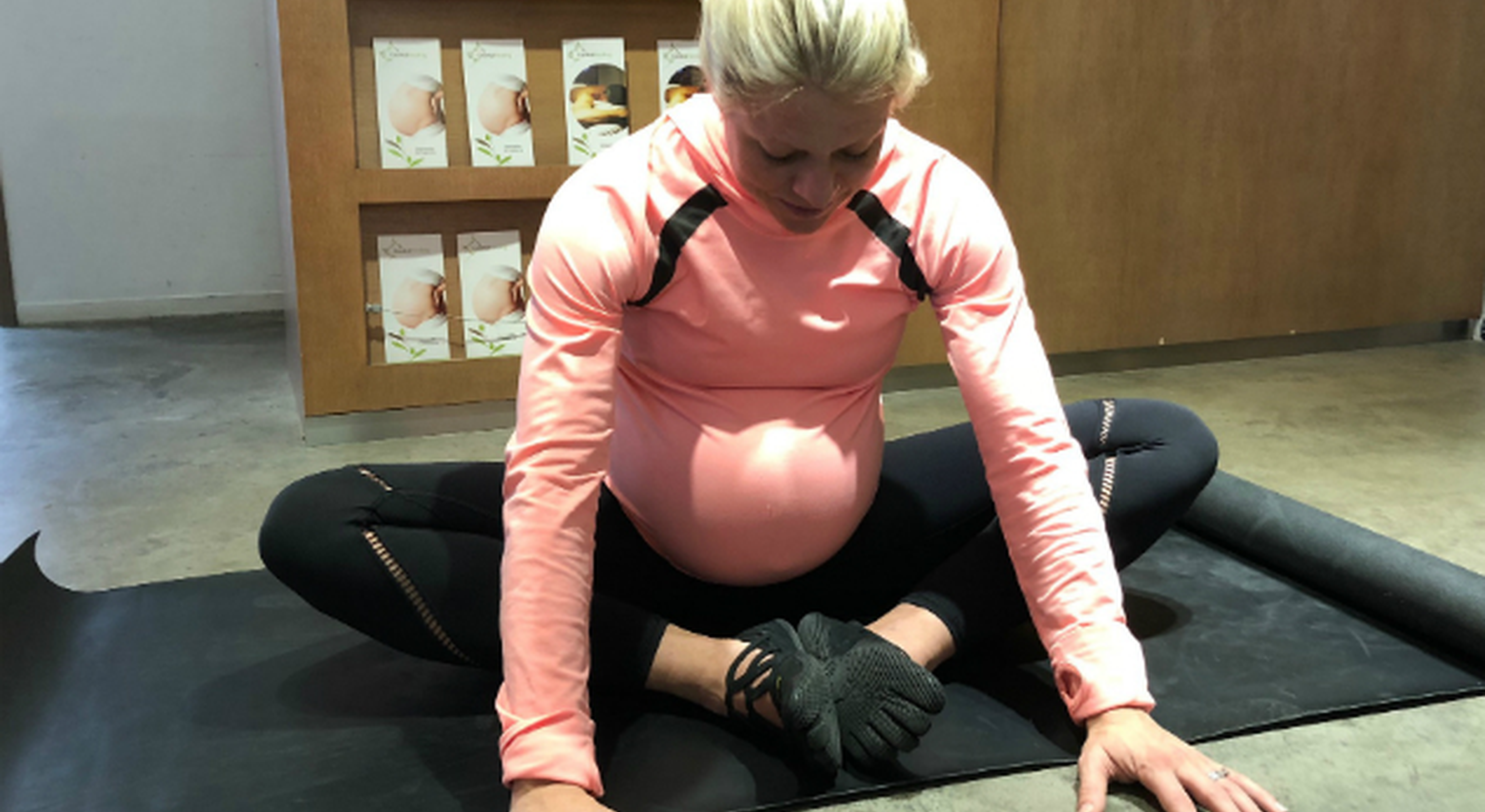 Pregnant woman striking diamond pose