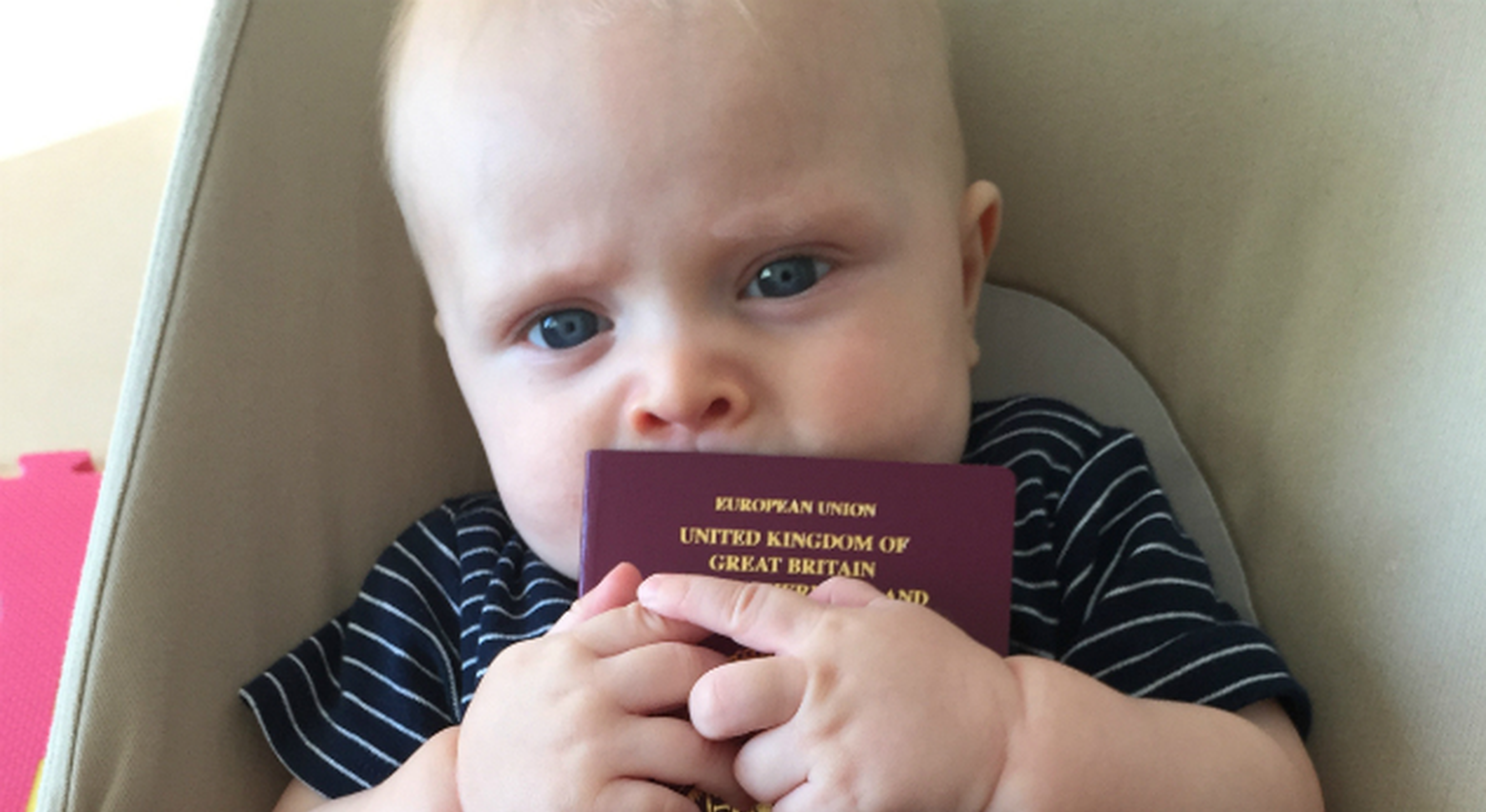 Baby boy holding British passport