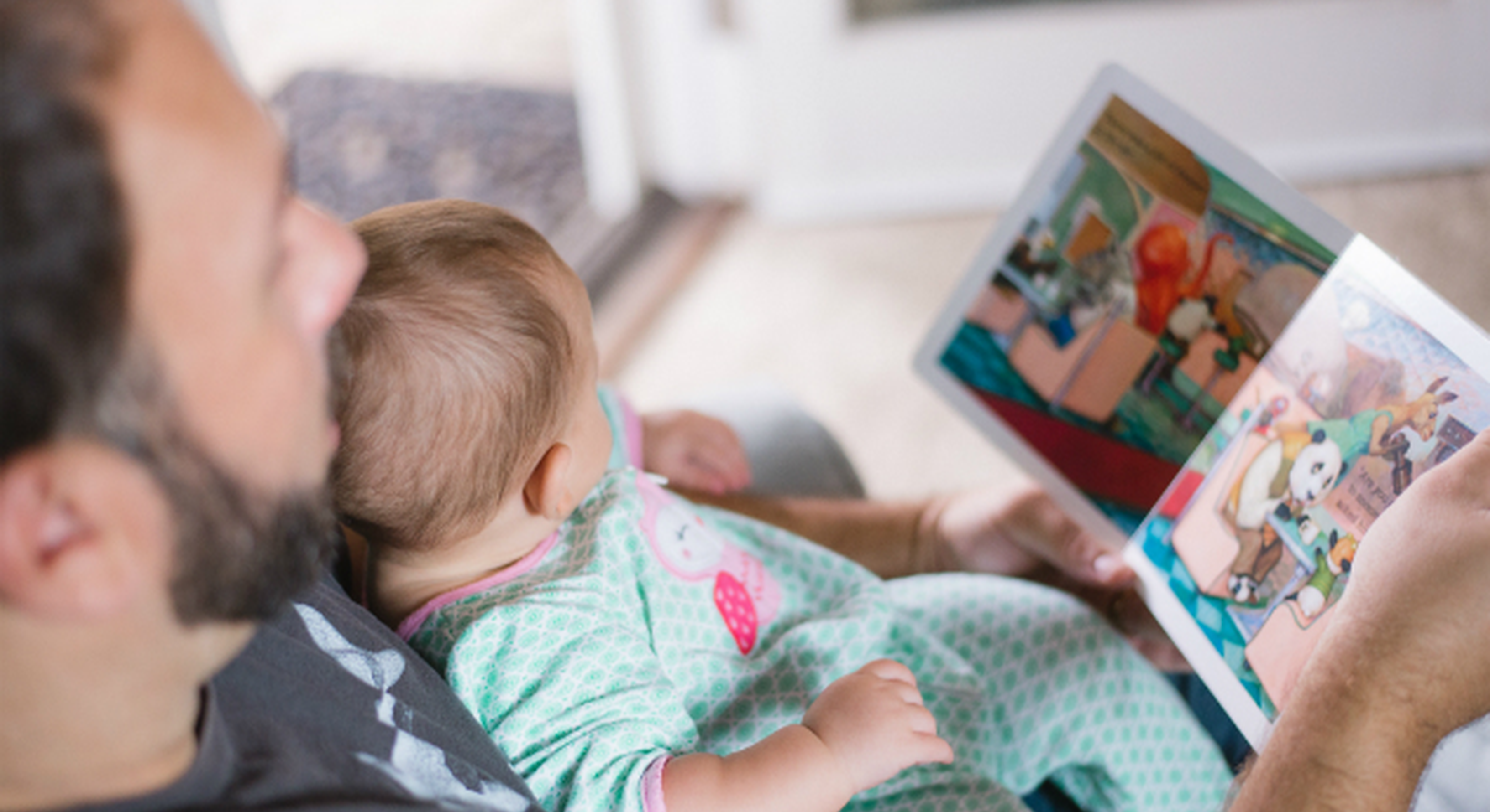 Dad reading to his daughter