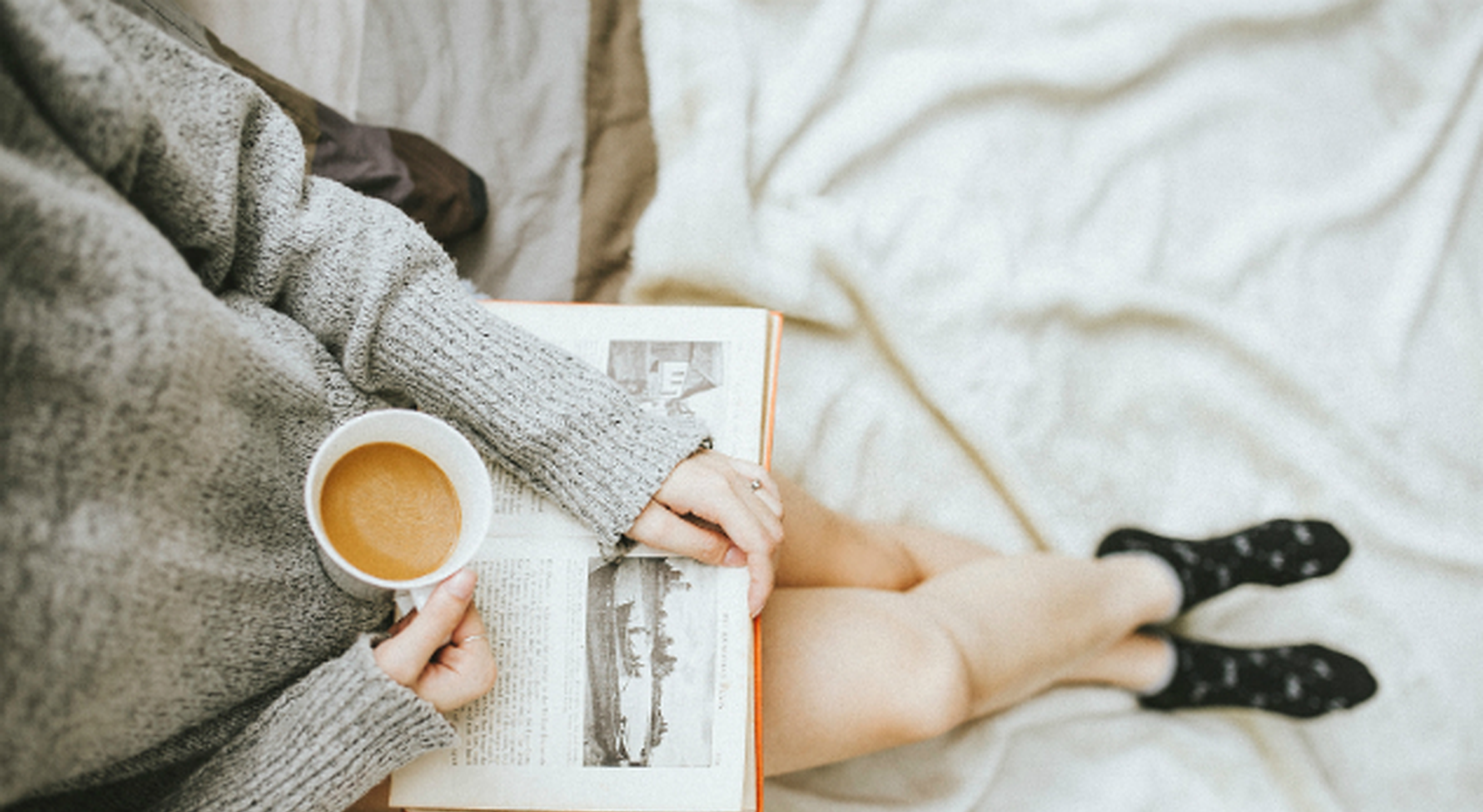 New mom relaxing and reading book