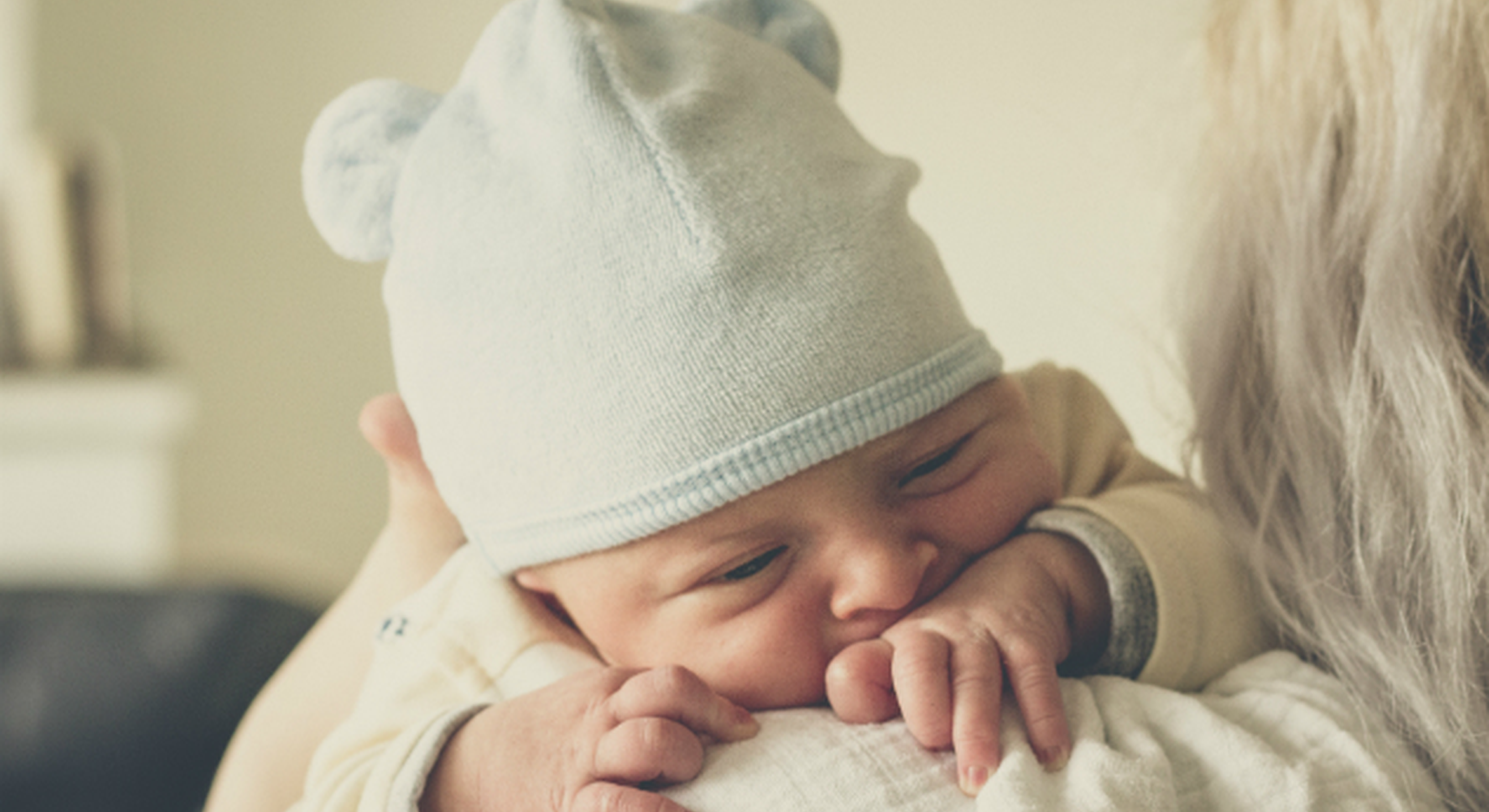 newborn baby on mom's shoulder