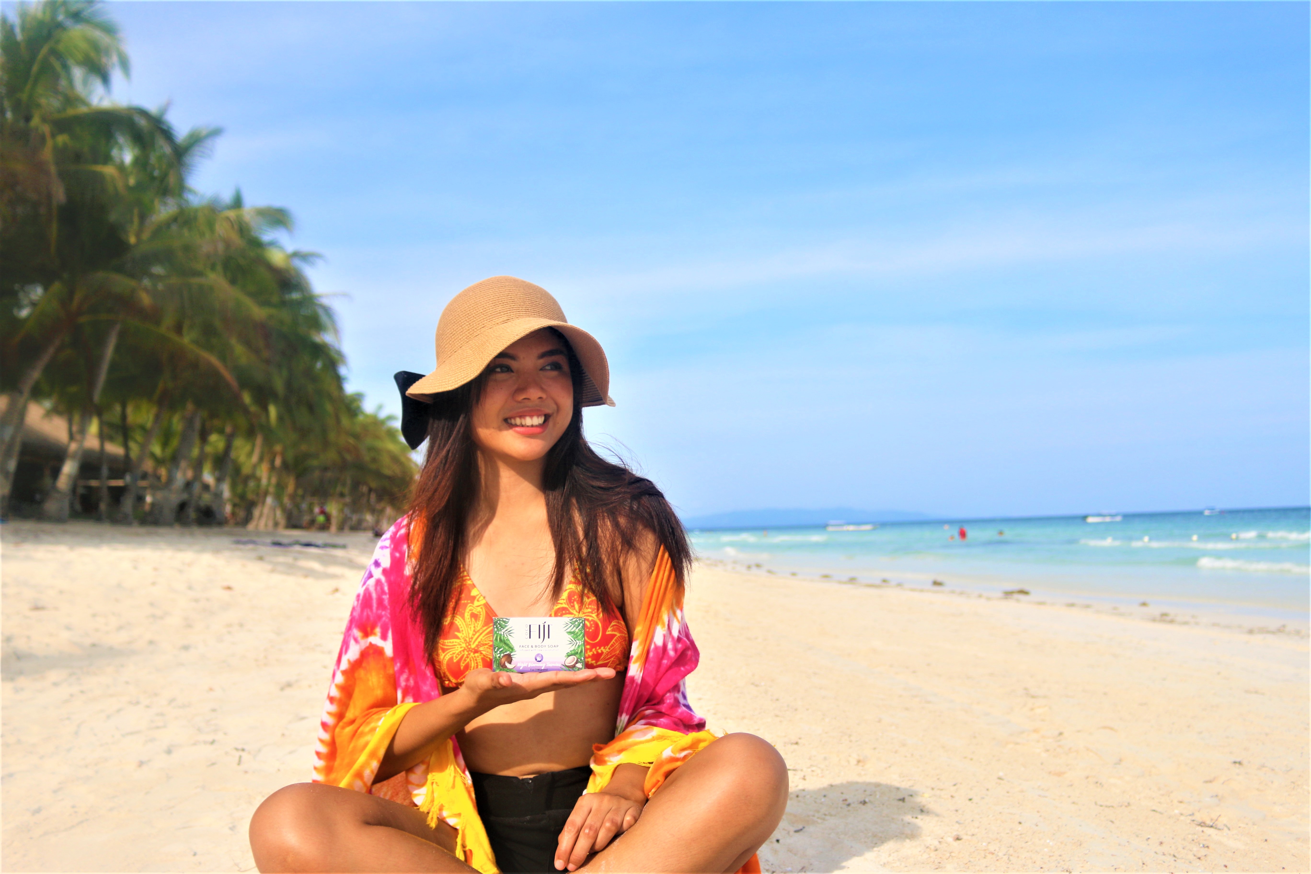 Organic Fiji Melt Coconut Oil. Girl holding coconut oil