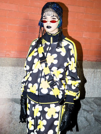 sita abellan wearing a marc jacobs black and green tracksuit