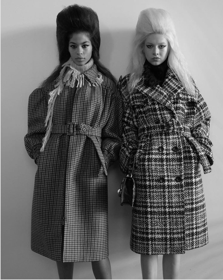 two models wearing patterned Miu Miu coats
