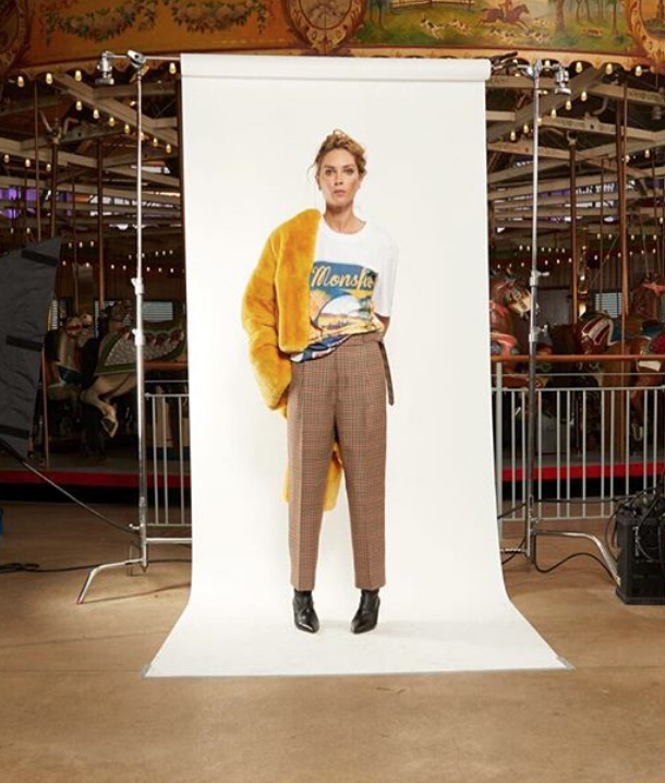 monse maison wearing a yellow jacket and brown chequered trousers