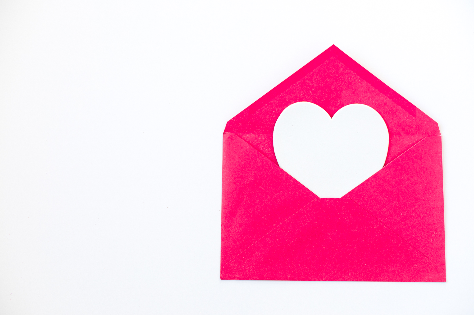 white heart, pink envelope, white heart poking out of envelope, tografy, photography business management