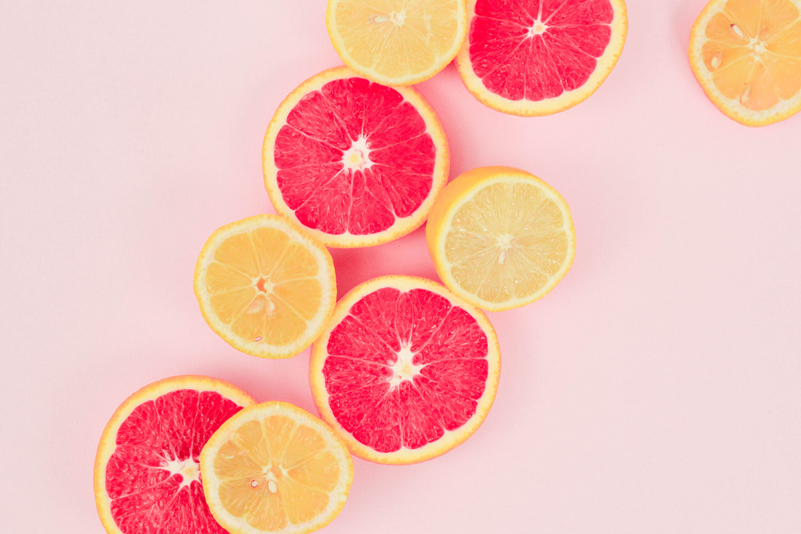 pink background, lemons and grapefruit, make lemonade, spring, fruit, cut fruit